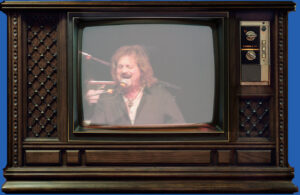Old television with music show on the screen